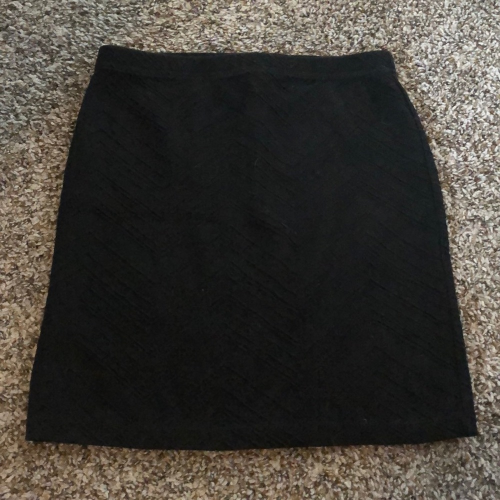 Black pencil skirt. Is stretchy material.
